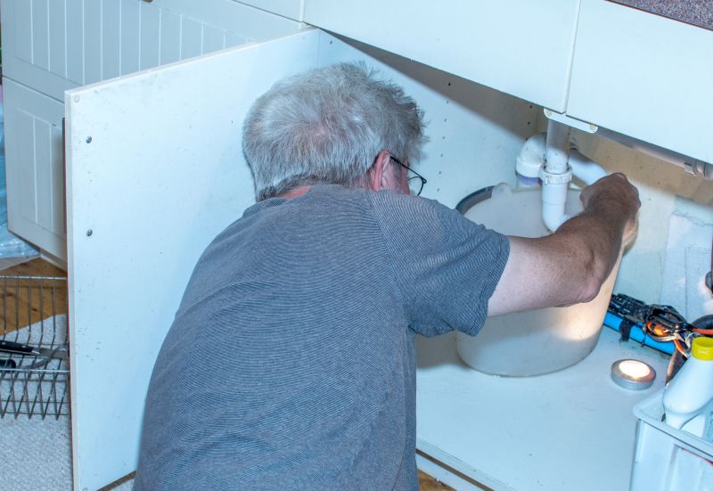 Handyman fixing a sink